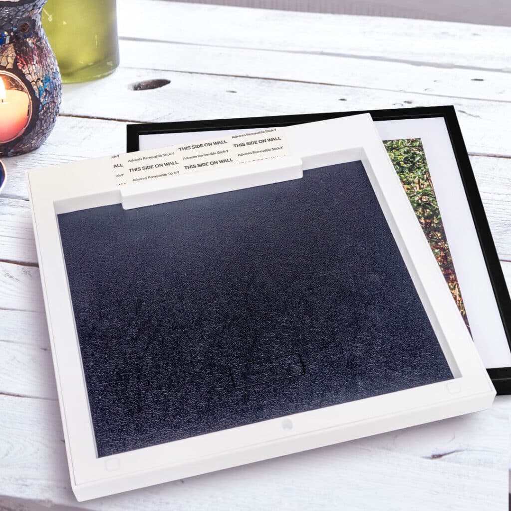 Photo tiles include self-adhesive strips for sticking and repositioning on the wall