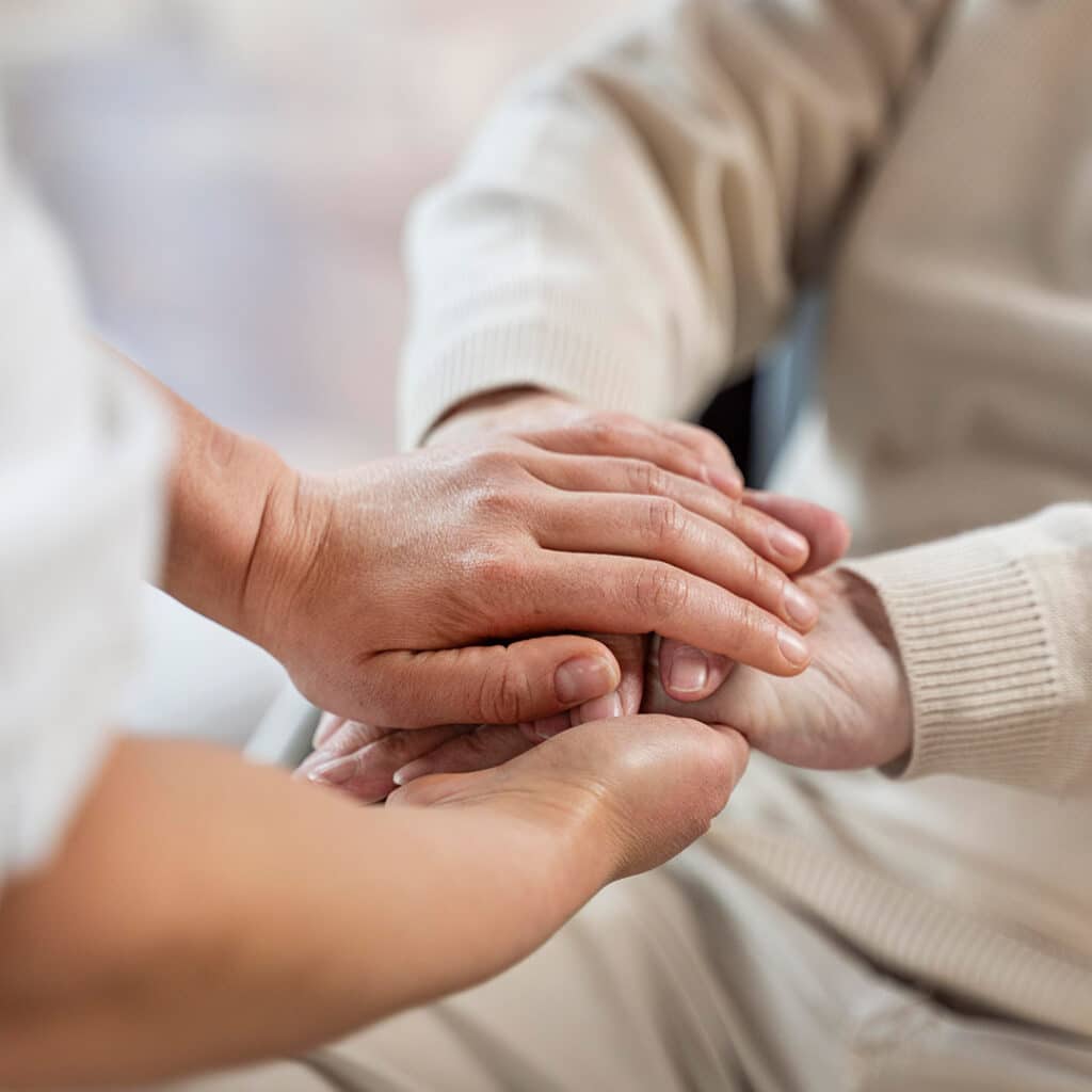 A close up of people holding hands