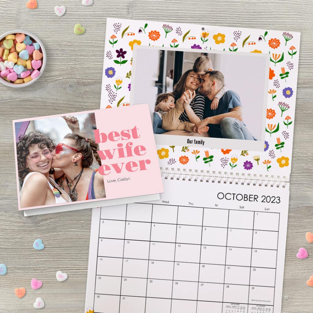 Macmillan photo gifts laid out on a table with heart shaped sweets scattered around